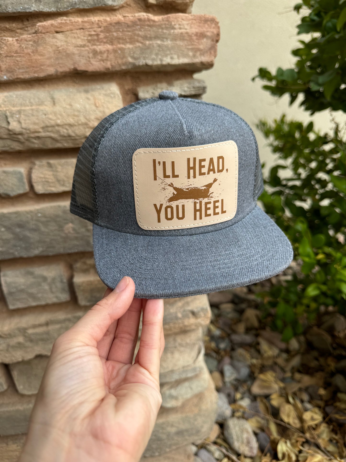 I’ll Head You Heel Patch Snap Back Hat